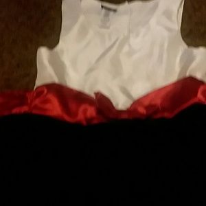 White and black dress with a red satin sash